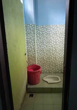 Habitación doble Deluxe | Baño | Regadera y toallas 