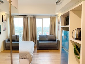 Family Studio | Individually decorated, desk, laptop workspace, free WiFi - Altiz Apartments at Bintaro by OkeStay (South Tangerang)