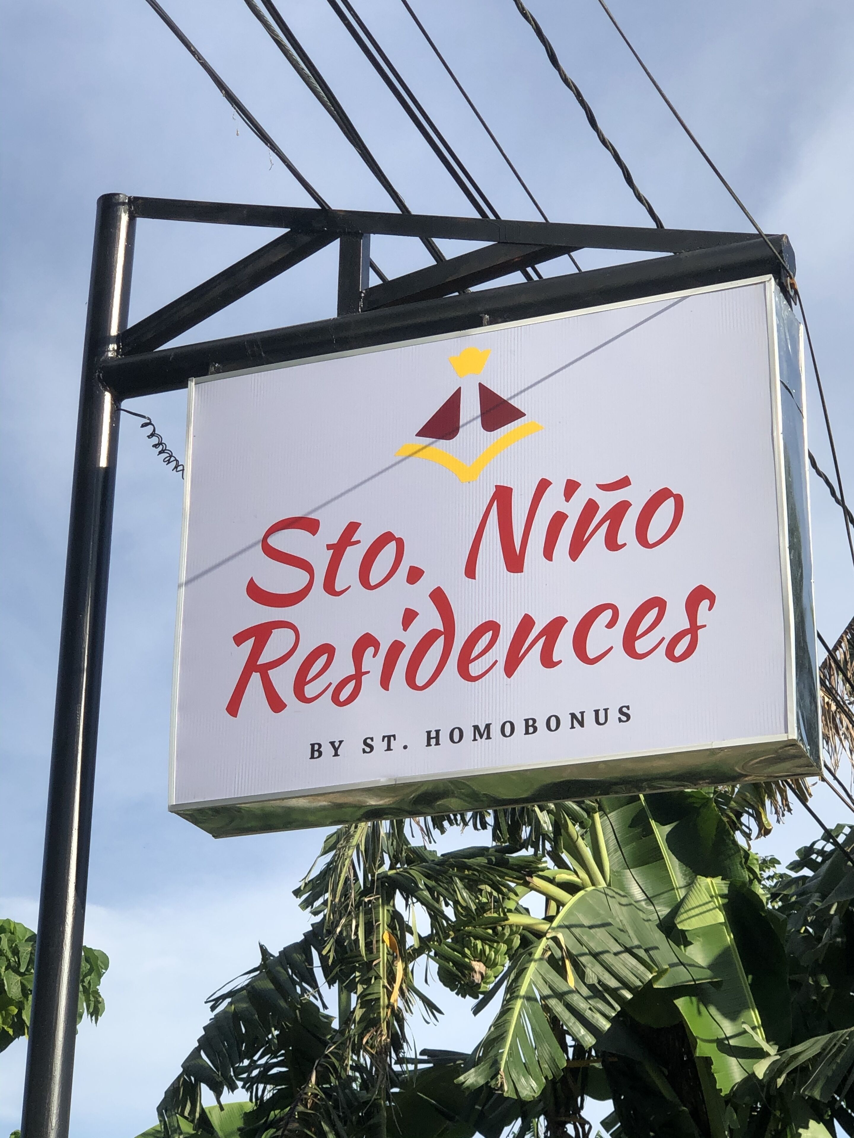 A sign for St. Niño Residences by St. Homobonus.