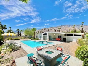 A pool with lounge chairs, a modern house, and a mountain backdrop. - Jazzy Mid-Century Designer with Speakeasy (Palm Springs)