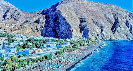 En la playa, arena negra, traslado desde/hacia la playa