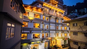 A multi-story hotel with balconies and a courtyard. - NRS KINGSTON (Gangtok)