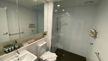 Executive Condo | Bathroom | Shower, towels, toilet paper