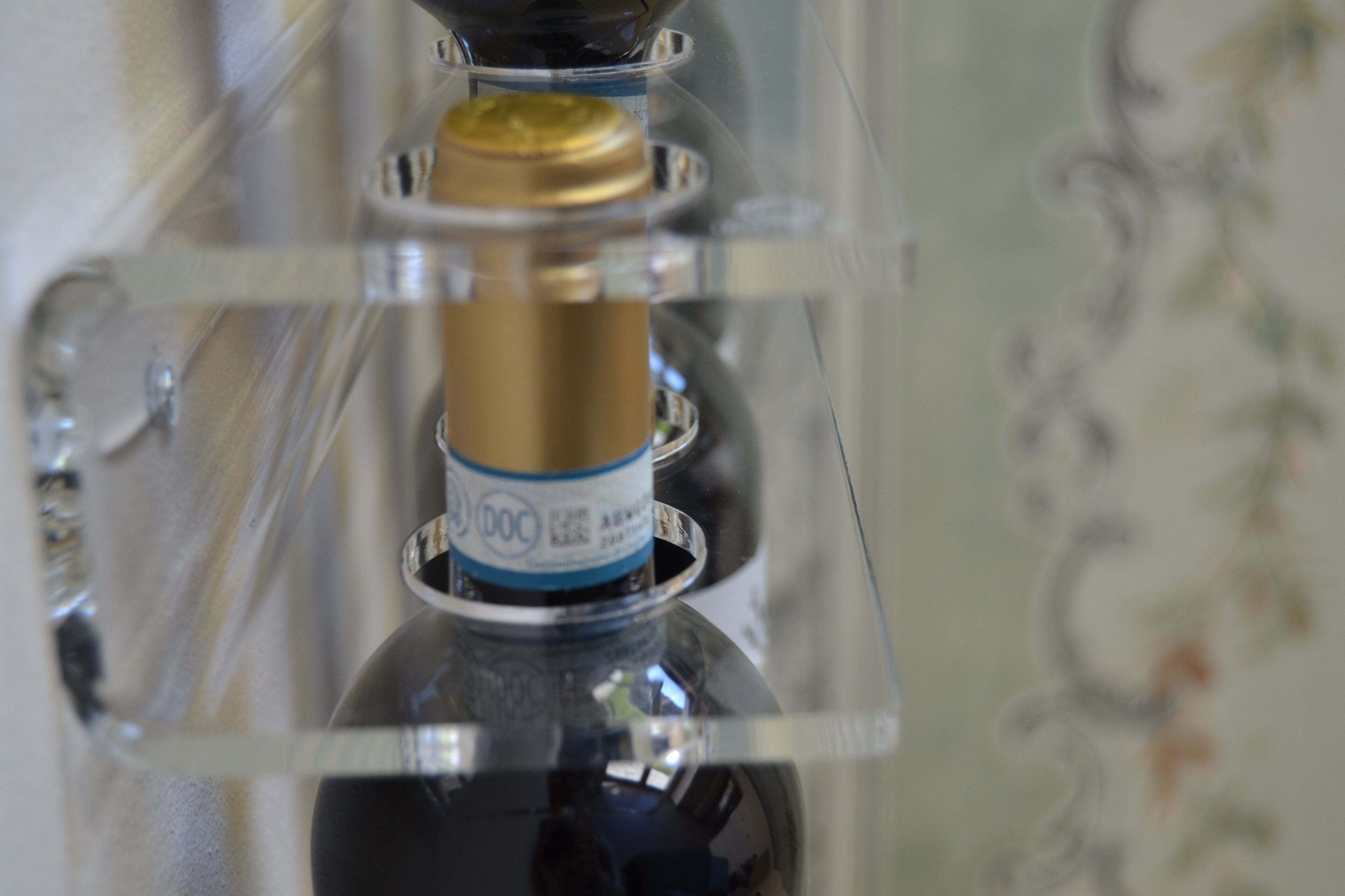 A clear plastic bottle with a label, possibly containing a beverage.