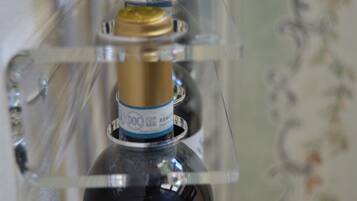A clear plastic bottle with a label, possibly containing a beverage.