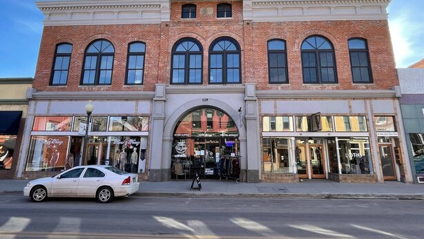 A two-story building with a brick facade, large arched windows, and a prominent entrance. - Our Happy Place -Downtown Dazzling S Mountain View (Salida)