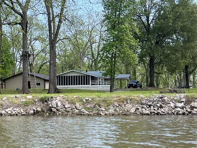 Cabin sits in the back of a wild pecan grove over looking the Arkansas River