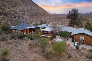 A desert-style property with multiple cabins, outdoor seating areas, and a pool. - Moonbeam Mountain - Stylish Suites + Hot Tub (Joshua Tree)
