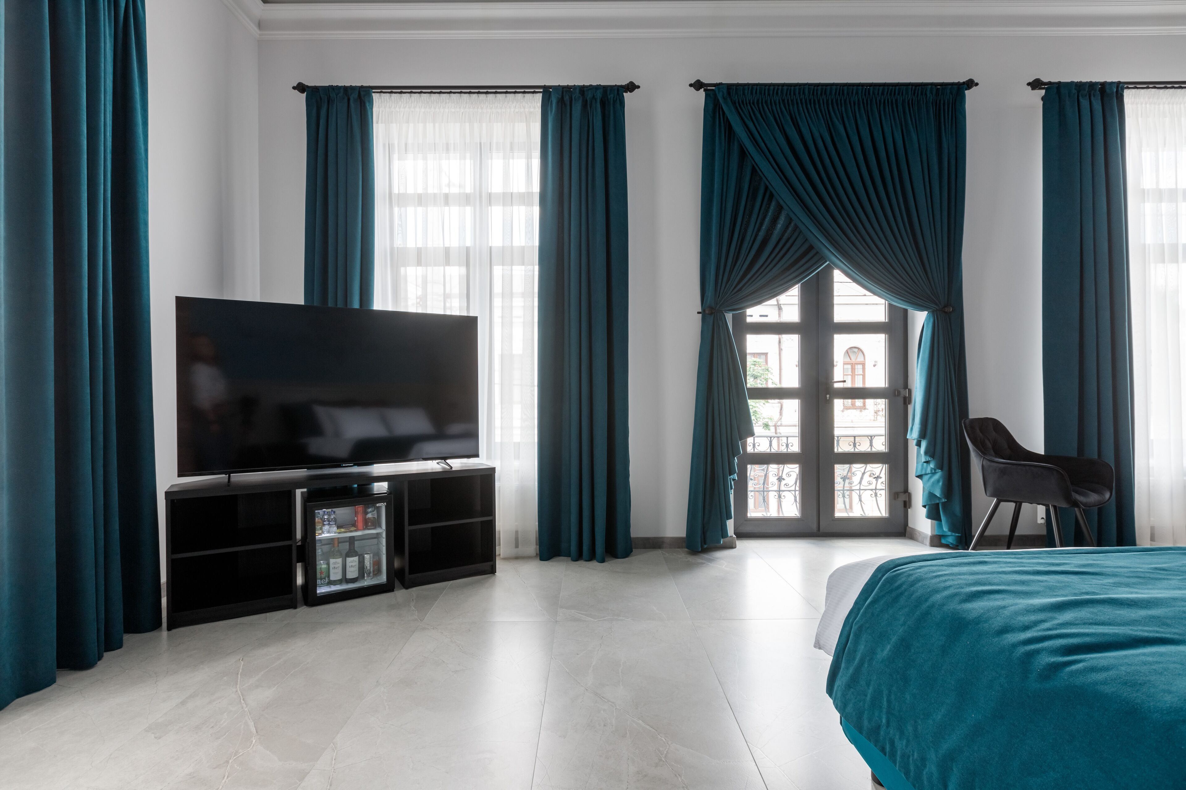 Suite exclusiva | Minibar, caja fuerte, escritorio y cortinas opacas