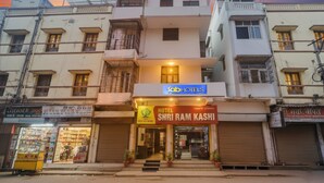 A hotel named "Hotel Shri Ram Kashi" with a signboard, a storefront, and a visible entrance. - FabHotel Shri Ram Kashi (Prayagraj)