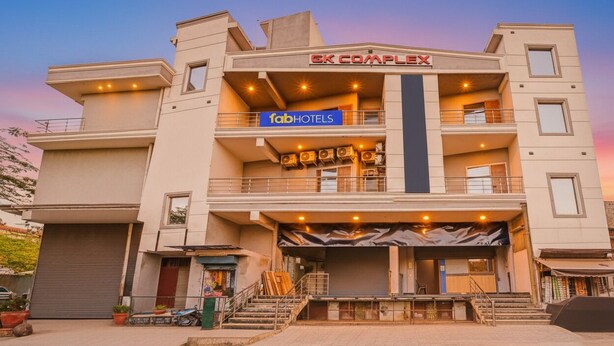 A multi-story hotel with balconies, a sign for 'fabHOTELS', and a 'GK COMPLEX' sign above. - FabHotel GK Residency (New Delhi)