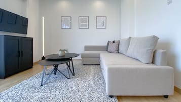 City Apartment | Living area | 40-inch Smart TV with digital channels, TV
