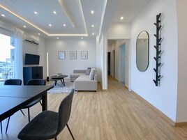 City Apartment | Living area | 40-inch Smart TV with digital channels, TV