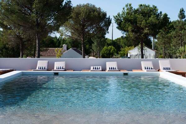 15 outdoor pools, pool umbrellas, pool loungers