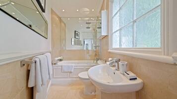 Bathtub, hair dryer, towels