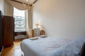 Appartement, Plusieurs lits | 4 chambres, accès au Wi-Fi (inclus), literie fournie