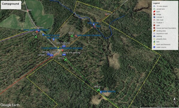 A campground with multiple tents, a water source, and a bridge. - Week discount. RV on 365 ac parcel with 15 Mile Stream running thru the property (Albion)