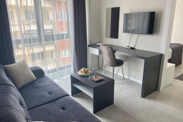 Classic Apartment, 1 Double Bed, City View | Living area | 30-inch Smart TV with satellite channels, TV, heated floors