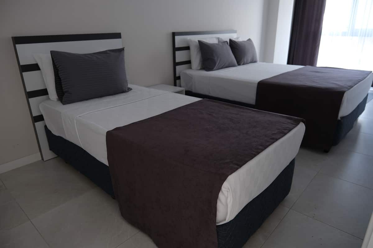 Economy Apartment, Multiple Beds, Smoking | 2 bedrooms, premium bedding, desk, laptop workspace