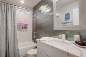 Bathtub, hair dryer, towels