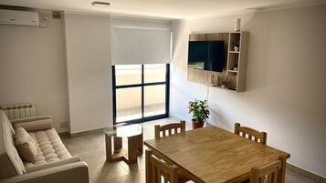Premium Apartment | Living area | 42-inch Smart TV with cable channels, TV, Netflix