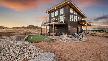 Enjoy a tranquil retreat with a spacious balcony, large windows, and a covered patio area perfect for relaxation.