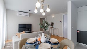 Gather around the elegant dining table, perfect for savoring meals, with thoughtful decor creating a warm and inviting atmosphere.
#DiningTable #ElegantGatherings #LovelyStay - Downtown Bliss w/ AC by LovelyStay (Porto)