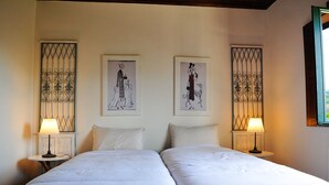 A double bed room with two bedside tables, each with a lamp, and two framed black-and-white illustrations on the wall. - Villa Ava - Four Bedroom Villa, Sleeps 8 (Refóios do Lima)