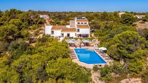 A large villa with a swimming pool surrounded by lush greenery. - Quinta Jordia - Twelve Bedroom Villa, Sleeps 26 (Lagoa)