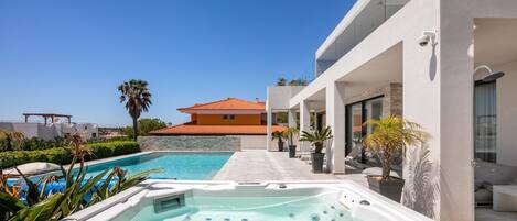 A heated pool, pool loungers