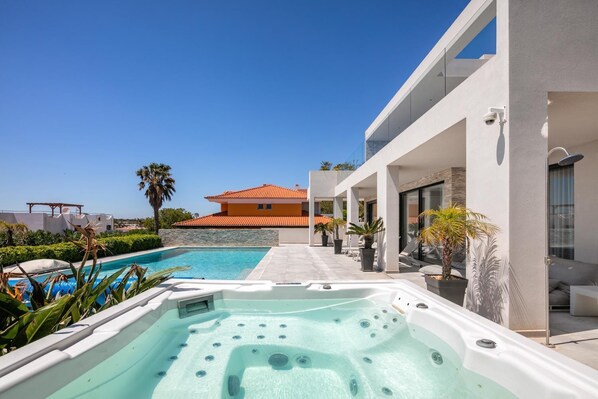 A heated pool, pool loungers