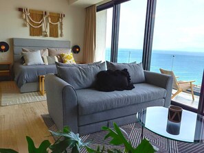 Deluxe Penthouse, 2 Bedrooms, Partial Ocean View | Living area | 50-inch Smart TV with digital channels - Nomada Boutique Habitat (Puerto Vallarta)