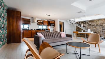 Deluxe Apartment | Living area | 55-inch Smart TV with digital channels, TV