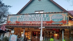 A building with a sign reading "General Mercantile Grocery Hardware Deli" and "Firewood Clothing". - Escape to Beech Mtn-0.6 mi to Ski Lodge-Walkable (Beech Mountain)