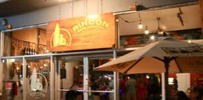 A restaurant with a prominent sign reading "Rincon Beer Company" and a large umbrella outside. - El Rinconcito RV Experience 2.0! Private Pool (Rincón)