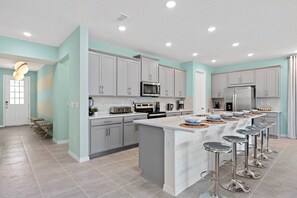 Enjoy casual dining at the central island with appliances and a clean, contemporary design.