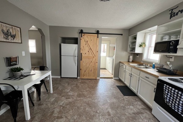 Fridge, microwave, cookware/dishes/utensils