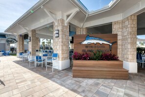 Relax on the covered patio with comfortable seating and enjoy the resort's tranquil atmosphere.