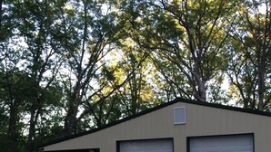A single-story building with a flat roof and two garage doors.