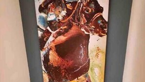A person standing in front of a large abstract painting in a hallway. - EVERYTHING LOUISVILLE GALLERY HOME 15% Discount (Louisville)