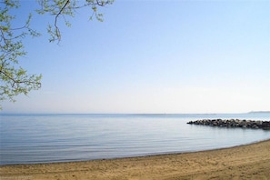 Enjoy a serene beach experience with calm waters and a natural shoreline.