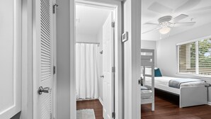 A room with a bunk bed, a ceiling fan, and a window with blinds. - 2 BR/2BA w/Stunning Marsh Views! Amenity access included! (Seabrook Island)