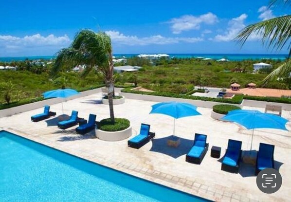 Outdoor pool, a rooftop pool - Modern Condo w/ resort amenities. Steps from Grace Bay Beach (Turtle Cove)