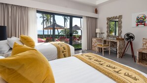 A hotel room with a large bed, a desk, and a view of the ocean. - Renovated 3BR Villa W/ Pool - Perfect for Couples , Bali Villa 2237 (Bali)
