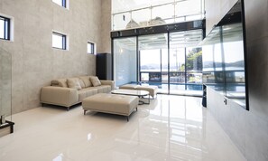 VIP 01 Pool Villa | Living area | 86-inch Smart TV with digital channels, heated floors