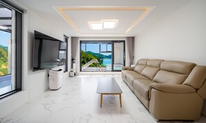 A01 Pool Villa | Living area | 86-inch Smart TV with digital channels, heated floors