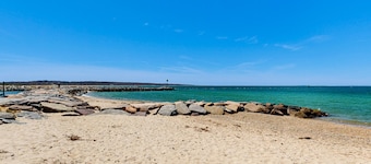 Water-view home in great location with spacious backyard, grill, kayaks, dogs OK