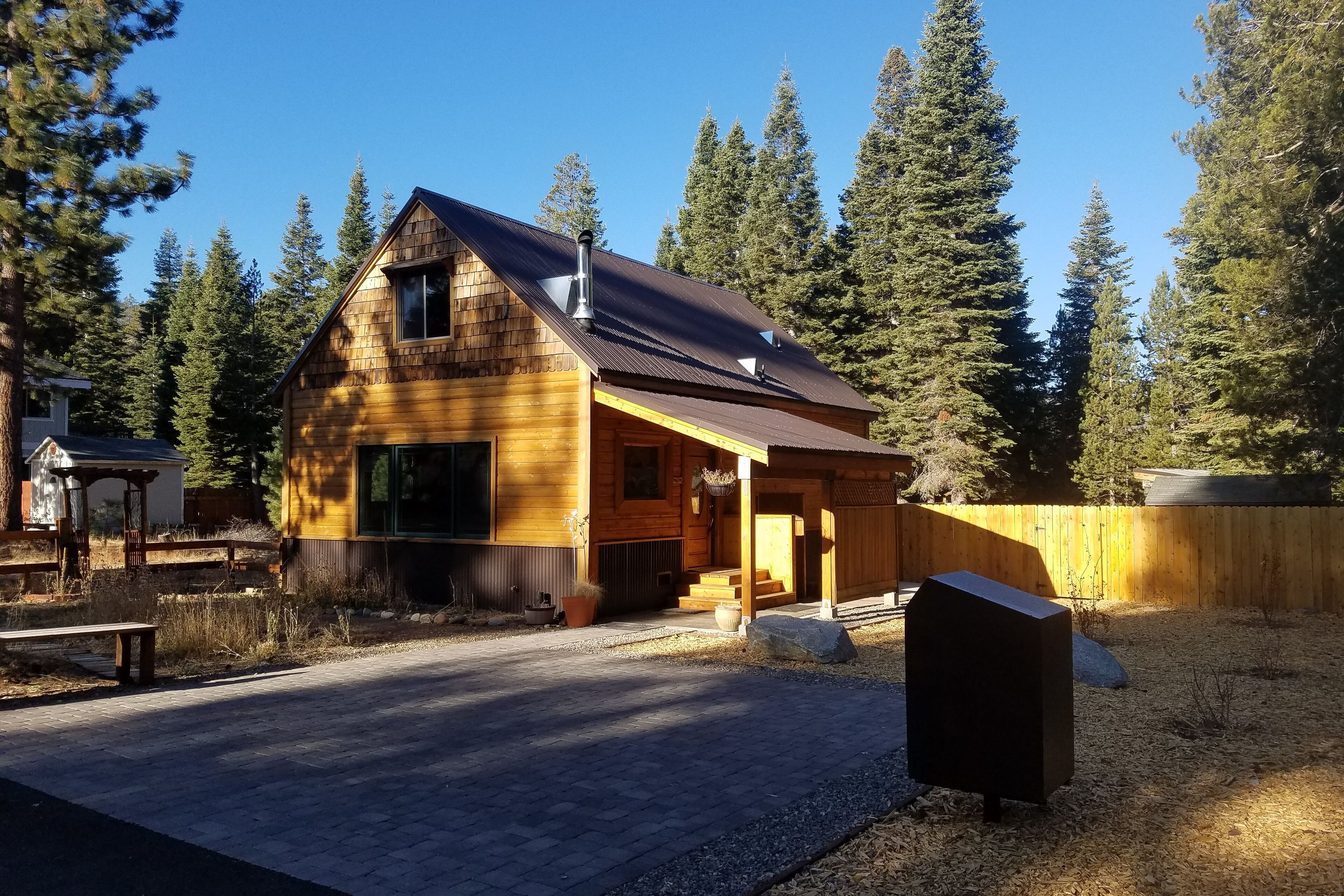 Charming two-story cabin with a private hot tub, patio, & large backyard