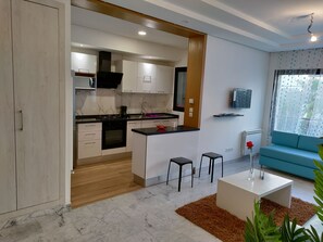 Fridge, microwave, stovetop, coffee/tea maker