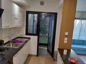 Fridge, microwave, stovetop, coffee/tea maker